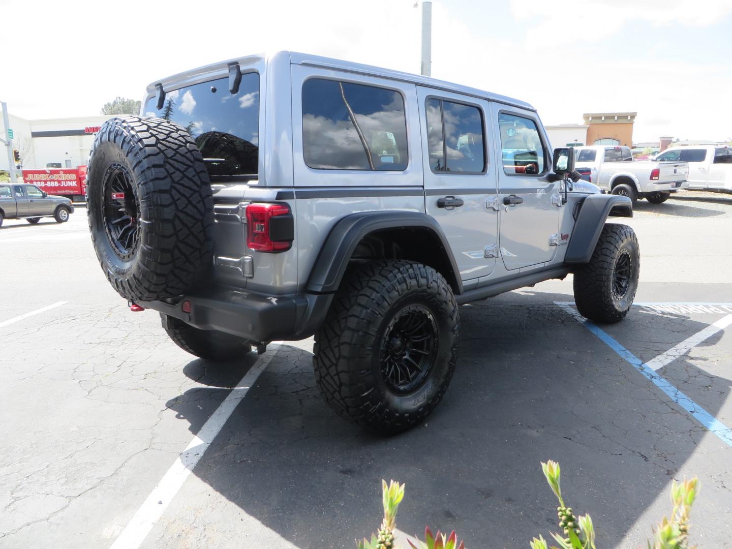 2021 SILVER /BLACK Jeep Wrangler Unlimited Rubicon (1C4HJXFG7MW) with an 3.6L V6 DOHC 24V FFV engine, 6A transmission, located at 2630 Grass Valley Highway, Auburn, CA, 95603, (530) 508-5100, 38.937893, -121.095482 - Features - Zone Offroad 3" Lift kit, Fox shocks, 37" Nitto Ridge Grappler tires, 17" Fuel Piston wheels, Warn winch, KC led lights, Voswitch switches, Teraflex HD tire relocation, Fire extinguisher, High Lift Jack, Shovel, Axe, Jumper Cables, and flat towable. - Photo#4